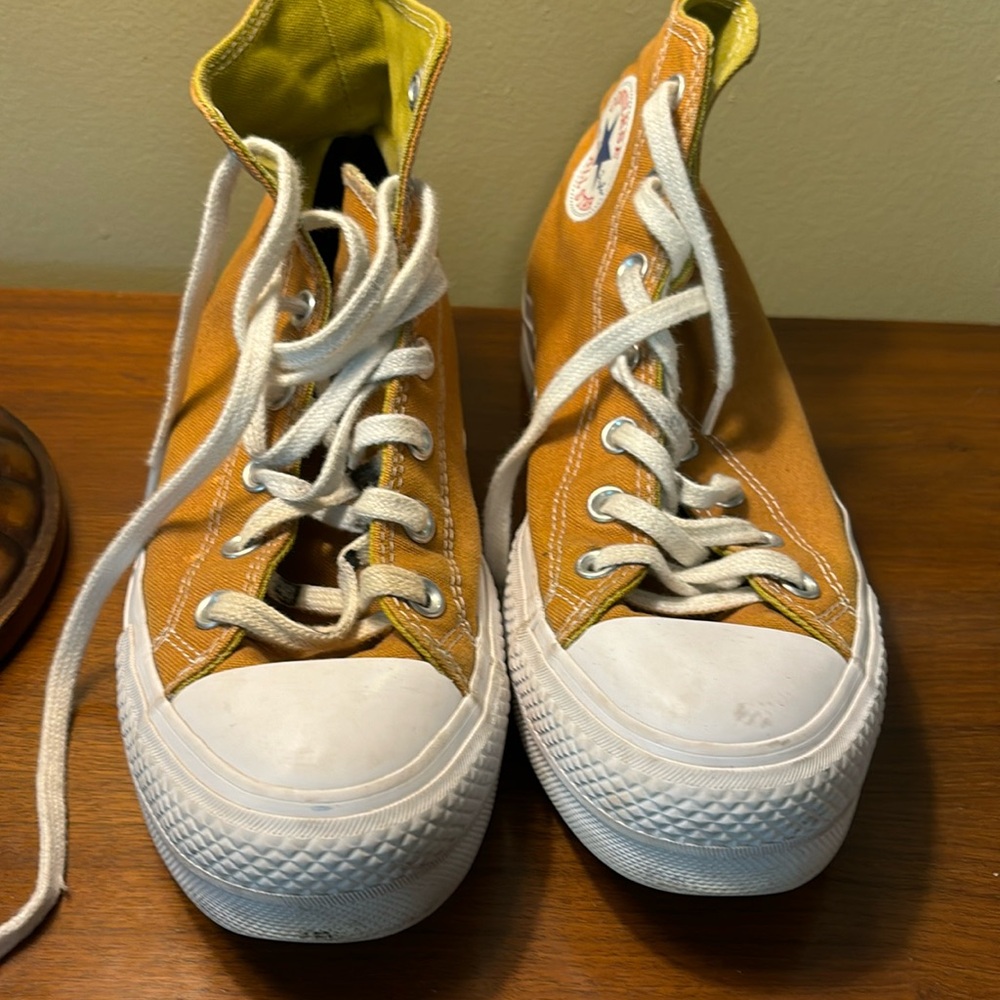 Converse hightops, size 6, men’s or eight women’s. Color gold.